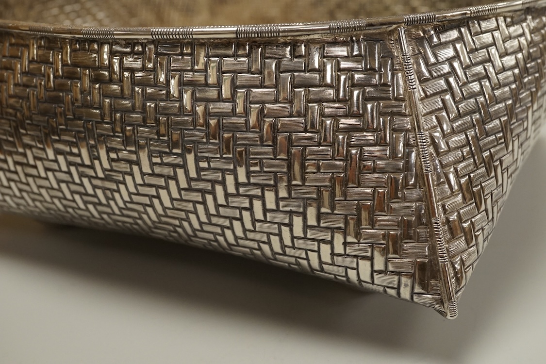An Indian or Middle Eastern white metal fruit bowl, with 'basket weave' decoration, indistinct marks, diameter 21.8cm, 10.2oz.